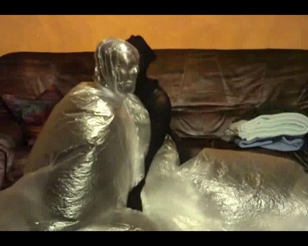 Breathless Bagging Sex 2 - Yvonne puts her friend in the second part into the big plastic bag. But he gets a little plastic bag over the head before. He does still few air good then another pantyhose over the head with that. After that she puts him into the big plastic bag completely.