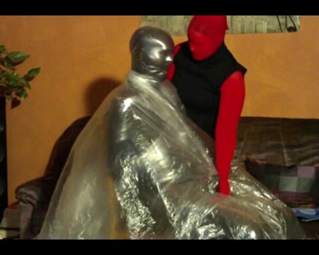Pantyhose  Orgasm 2 - Like in the first part yvonne's friend is tied up and sits on a chair. But yvonne has a gigantic plastic bag in the second part. Your friend is surrounded by plastic completely. Again and again she draws the plastic to his face and strokes his cock. He always gets less air and ...