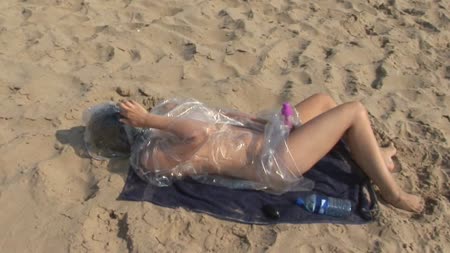 Alone On The Beach - What happens when you give chaos a plastic coat an inflatable latex hood and a vibrator. Well come and take a look as chaos is all alone on the beach as she entertains herself in a way only she knows how!!