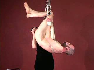 Rubber & Bondage Central! - Suspended And Flogged