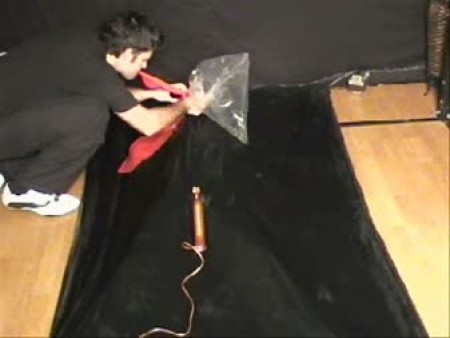 Lana Vacbed Test - In this update lana climbs inside the black latex vac bed. With her in place, the bed is then deflated leaving lana sucked down tight. She then undergoes different breath reduction tests. She has to rebreath into a clear plastic bag thats secured to her breathing tube, she also has a black rubber rebreathing bag pushed onto her breathing tube. And of course the pinch tube where no air is allowed into the breathing tube.