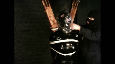 Heavy Rubber & Bondage - Hooded And Bagged On The Cross Heavy Rubber & Bondage - Hooded And Bagged On The Cross