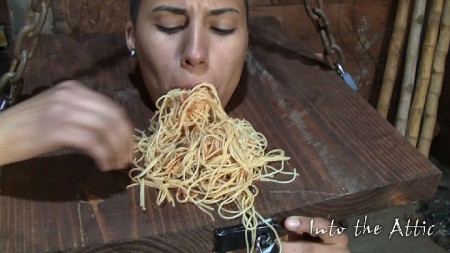 Feed Time For The Slave - In the old out building now. She is butt naked standing with a heavy wooden square of wood around her neck. It is chained to the ceiling and pulled up taunt. She is unable to sit down or move from the spot she finds herself in. A gag is buckled into her face hole. The dumb cunt came here complaining about being hungry. Within a couple of minutes she calls out through her gag, im hungry. Getting no answer back she calls out again. Jr can be heard in the kitchen preparing something. He comes out to address her and removes her gag. He then dumps a pile of cold spaghetti noodles onto the wood piece around her neck. It is large enough that it creates an area just in front of her face where the noodles now sit. He then dumps a pile of cold red sauce on the top of them and tells her she can get busy eating it. She doesnt waste any time pushing those noodles into the hole in her face. She keeps a continual supply ******* from her mouth as she chews incessantly. When the pile grows smaller she just keeps raking them back up into a pile and shoving them in. She never stops eating and chewing until they are completely eaten. She even licks her fingers clean when the noodles are consumed. When she is done jr comes out with a little stool, sits down in front of her and begins assaulting her clit with a tiny high powered vibrator. Just before he lands it on her cunt she is still cleaning her plate and licking her fingers but the very instant she feels the vib on her clit she stops what she is doing, grabs the wooden square around her neck with both hands and puts her face hole into the shape of a large o. She clearly is very focused now. Within seconds she is asking jr for permission.