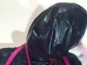 Karina In Bondage Wearing A Thin Rubber Hood