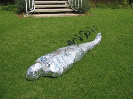 Mummified With Foil - Mummified with foil. I mummified my slave with foil and thought I would have some fun with him. I wanted to see if he would bake in the hot african sun. My fun was cut short and had to hide my slave under a clump of bushes due to unexpected guests. My plans were foiled. I only got him out the next morning.